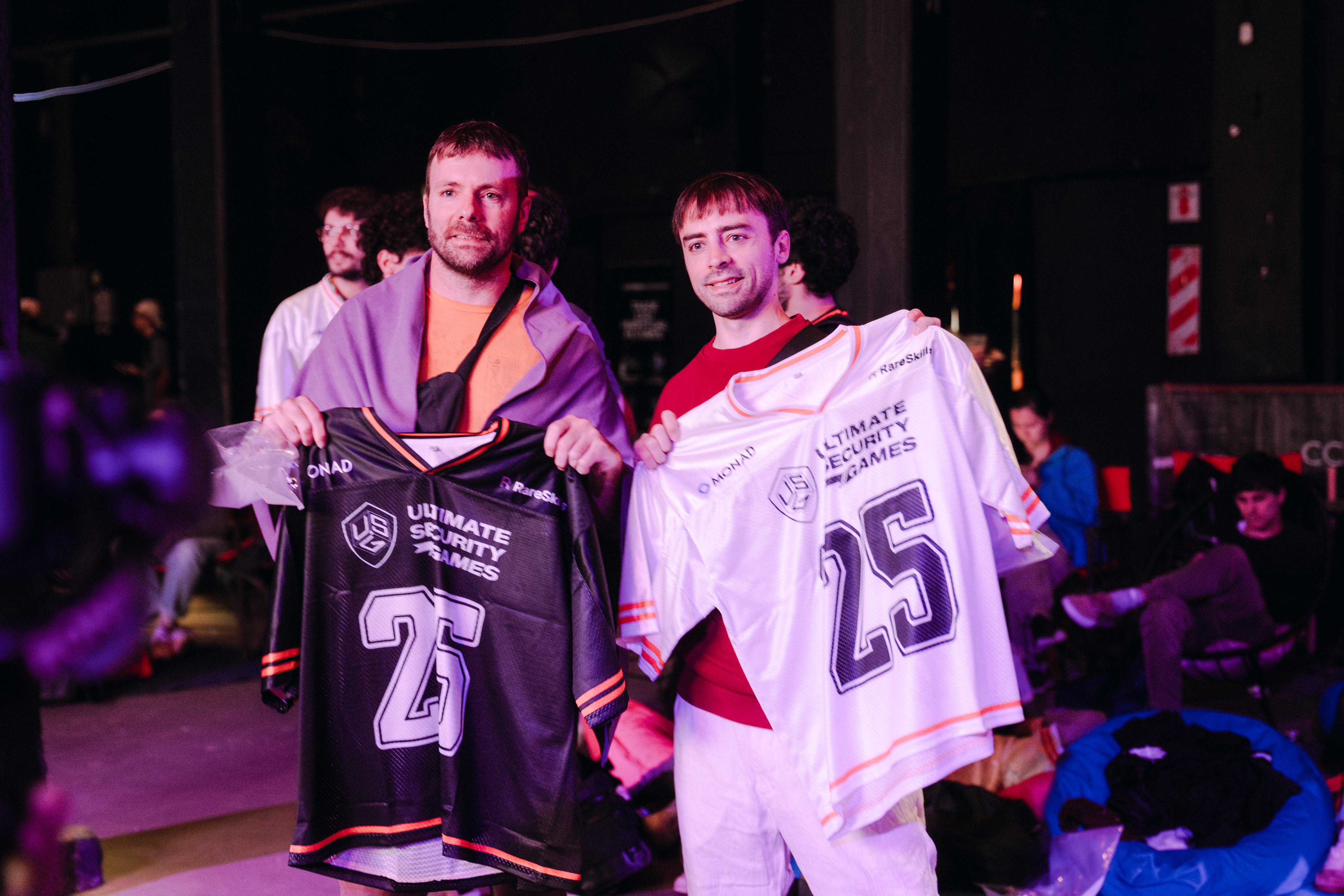 Competitors holding numbered USG jerseys